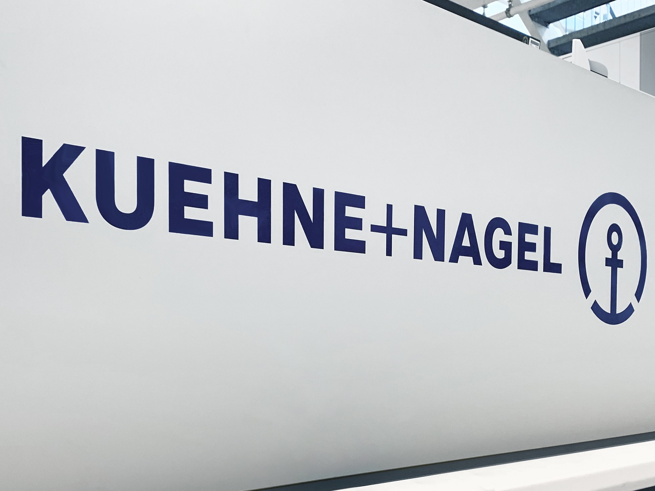 Kuehne+Nagel logo on white wall